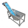 Vegetable washing conveyor with a grinding mill