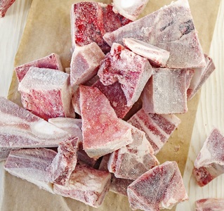 Frozen meat flaker for industrial processing